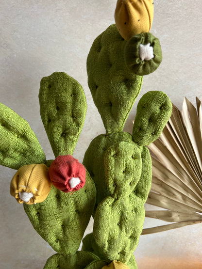 Opuntia in wool fabric complete with white ceramic vase and decorative stones.