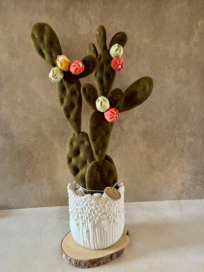 Opuntia in wool fabric complete with white ceramic vase and decorative stones.