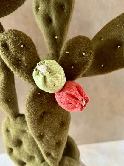 Opuntia in wool fabric complete with white ceramic vase and decorative stones.