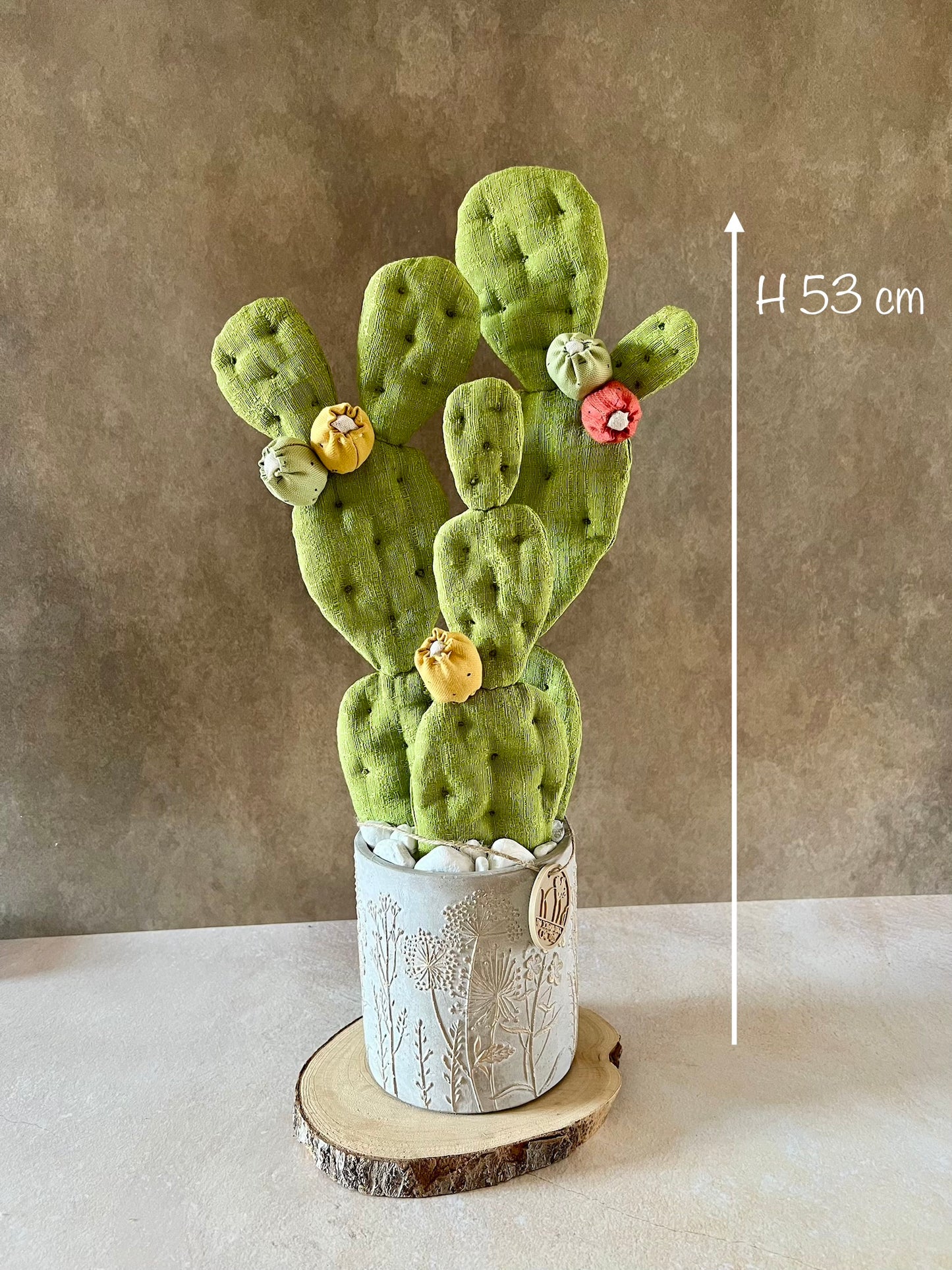 Opuntia in wool fabric complete with white ceramic vase and decorative stones.