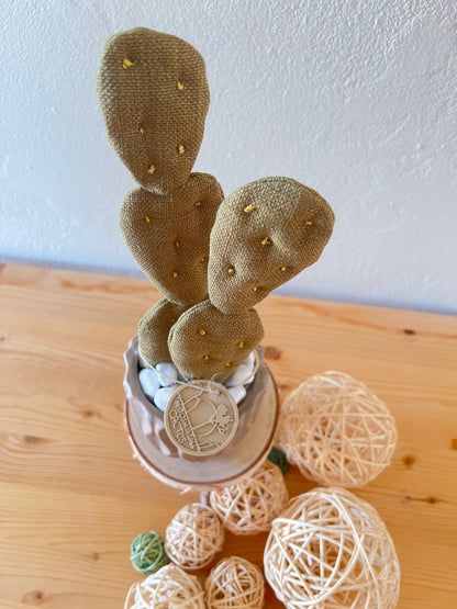 Opuntia in wool fabric complete with white ceramic vase and decorative stones.